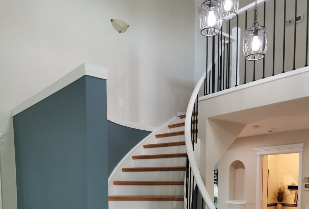 stained oak railing after being painted white - railing painting calgary